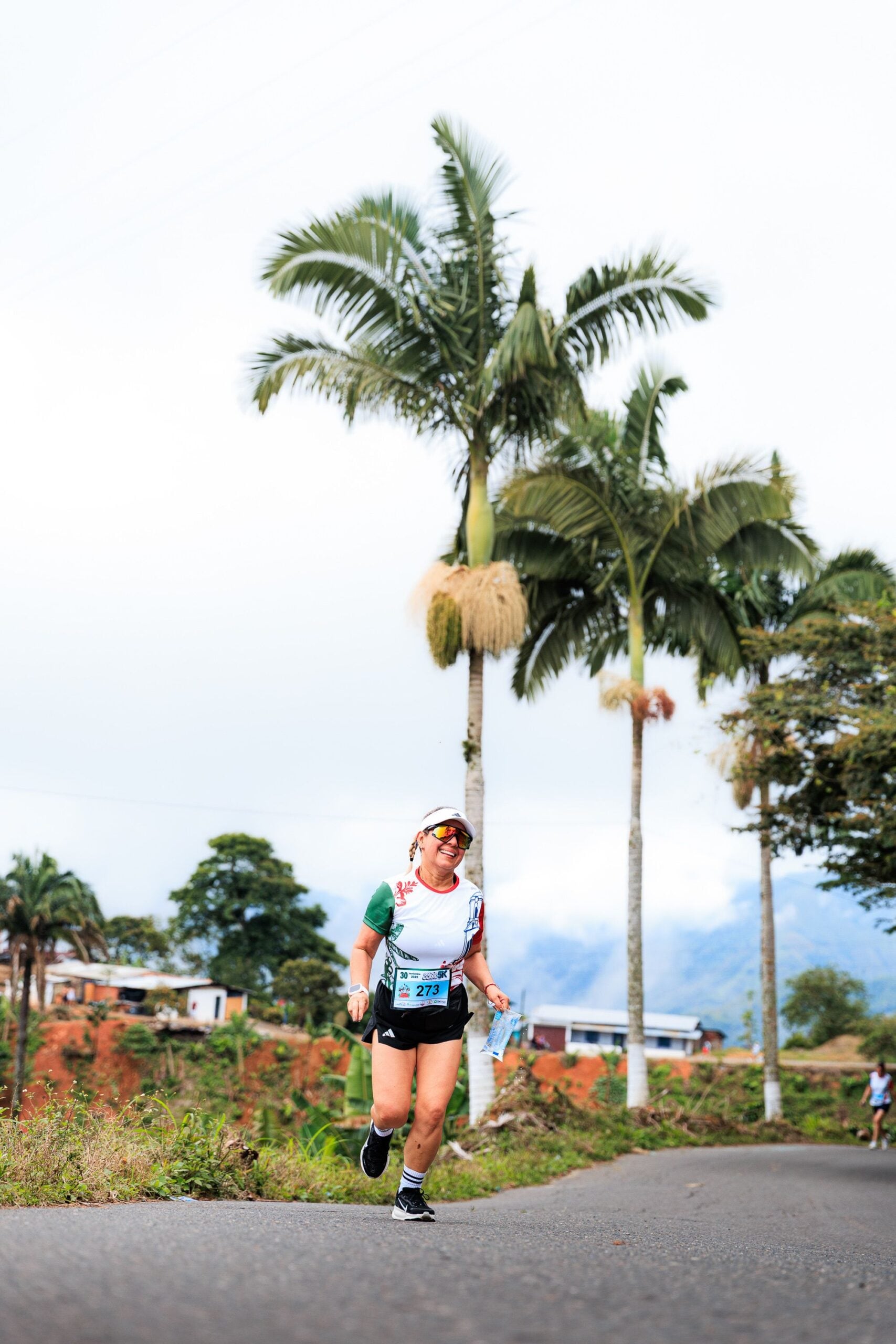 Woman running a race, active and pain-free after regenerative treatment at Pain Doctors Medical
